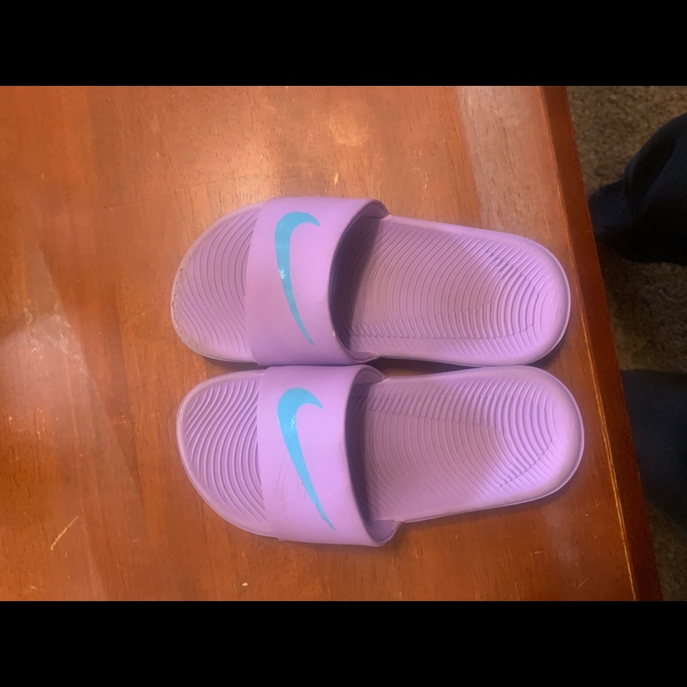 Lavender 12c Nike slides.